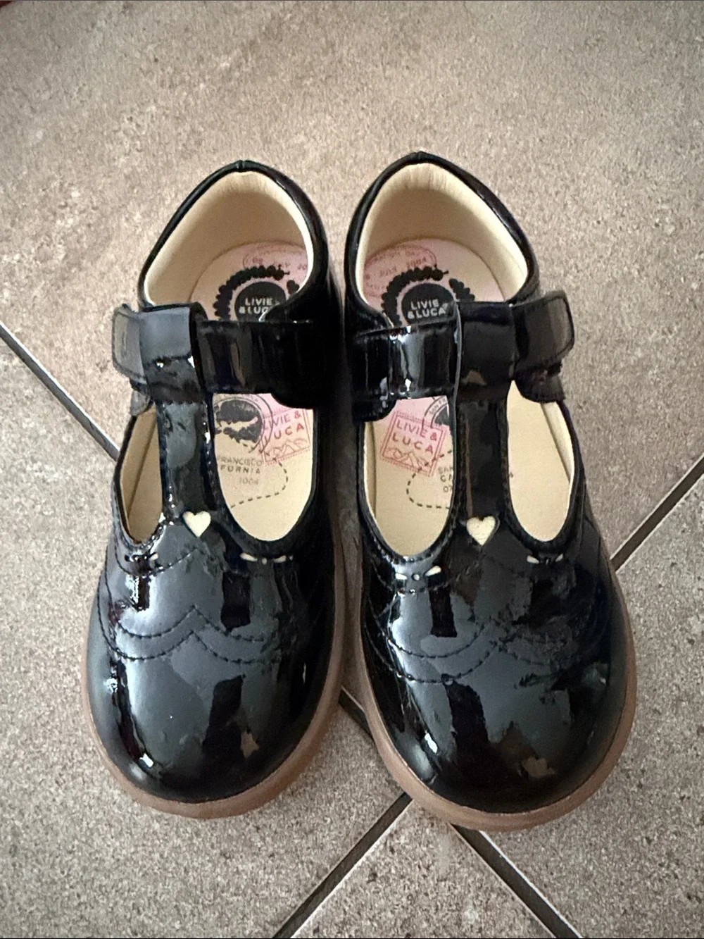 Livie & Luca Black Patent T-Strap Mary Janes with Heart Accent